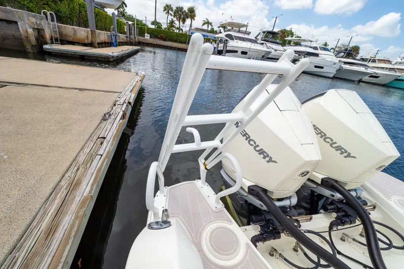 Slide: The Image of 2019 Boston Whaler 270 Vantage with Mercury engines docked at marina. - 27