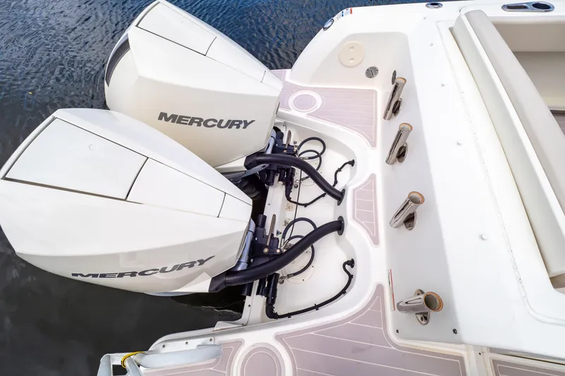 Slide: The Image of 2019 Boston Whaler 270 Vantage with dual Mercury outboard engines on water. - 28