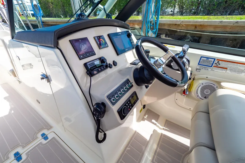 Slide: The Image of 2019 Boston Whaler 270 Vantage helm with modern controls and navigation equipment. - 4