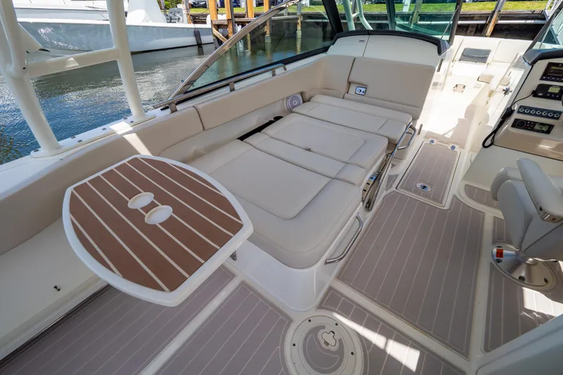 Slide: The Image of 2019 Boston Whaler 270 Vantage boat interior with seating and table. - 42