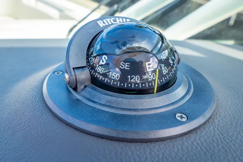 Slide: The Image of Compass on 2019 Boston Whaler 270 Vantage boat dashboard. - 49