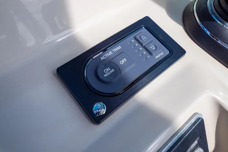 Slide: The Image of Active trim control panel on 2019 Boston Whaler 270 Vantage boat dashboard. - 52