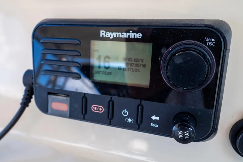 Slide: The Image of Raymarine marine radio on 2019 Boston Whaler 270 Vantage boat dashboard. - 54
