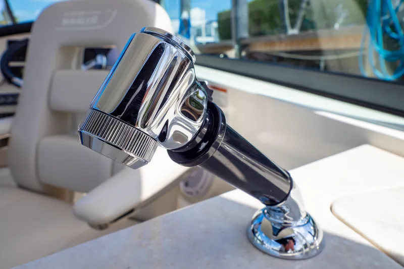 Slide: The Image of Close-up of a chrome faucet on a 2019 Boston Whaler 270 Vantage boat. - 59
