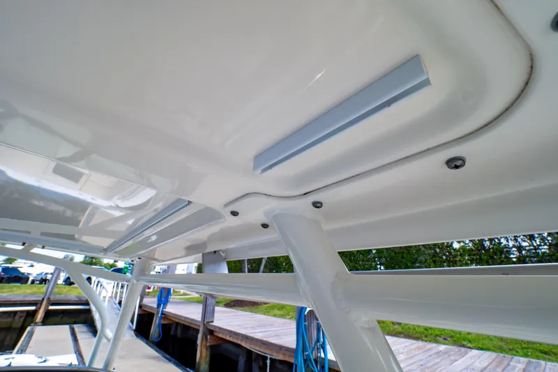 Slide: The Image of 2019 Boston Whaler 270 Vantage boat canopy detail at dockside. - 72