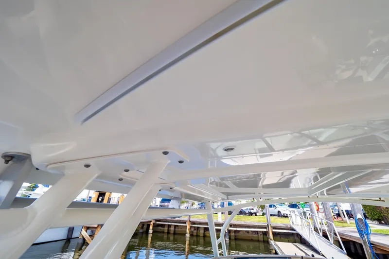 Slide: The Image of 2019 Boston Whaler 270 Vantage boat canopy and structure, dockside view. - 73