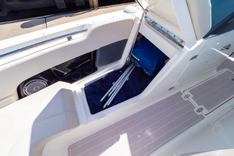 Slide: The Image of 2019 Boston Whaler 270 Vantage boat storage compartment with gear and accessories. - 86