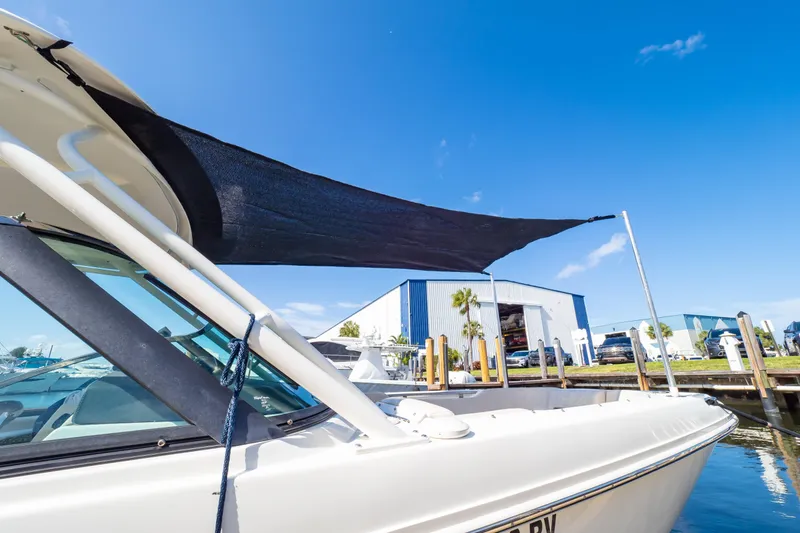 Slide: The Image of 2019 Boston Whaler 270 Vantage boat docked under clear blue sky. - 95