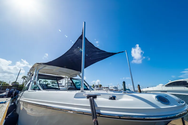Slide: The Image of 2019 Boston Whaler 270 Vantage boat docked under clear blue sky. - 96