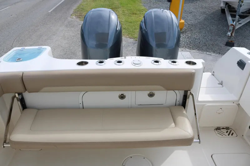 Slide: The Image of 2020 Sailfish 275 DC boat with dual engines and beige seating. - 20
