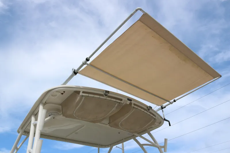 Slide: The Image of 2020 Sailfish 275 DC boat canopy against a clear blue sky. - 6