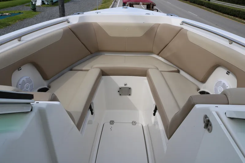 Slide: The Image of Spacious seating area on 2020 Sailfish 275 DC boat with beige cushions. - 7