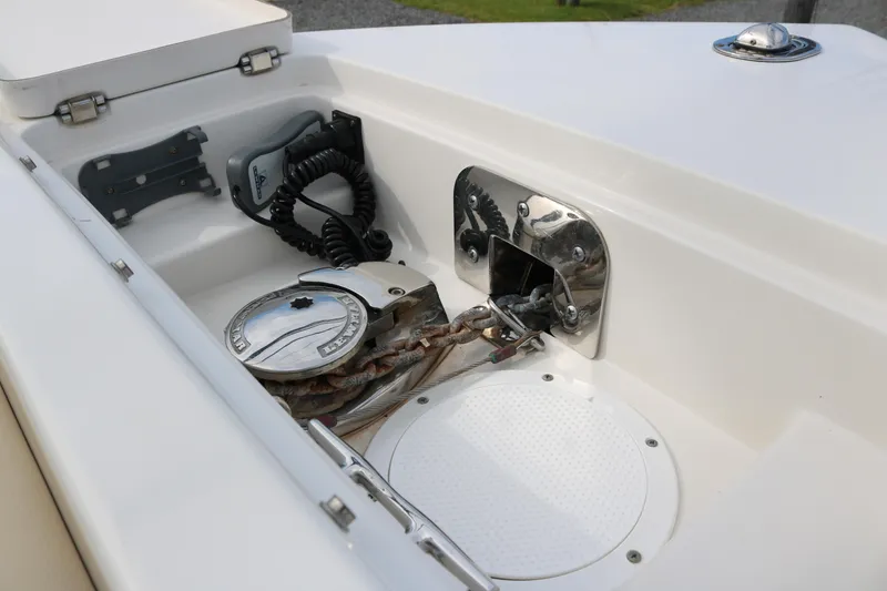 Slide: The Image of Anchor compartment of 2020 Sailfish 275 DC boat with winch and rope. - 8