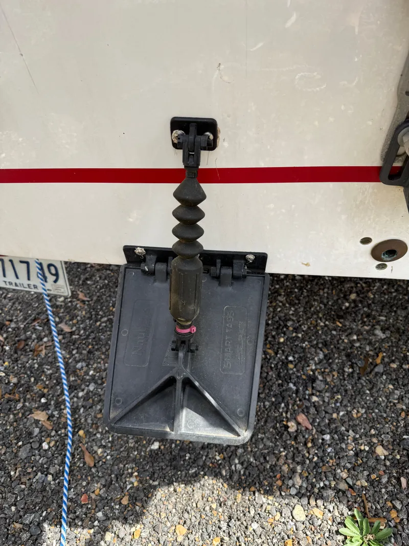 Slide: The Image of Holland 14 boat rudder, model 2020, on gravel surface. - 2