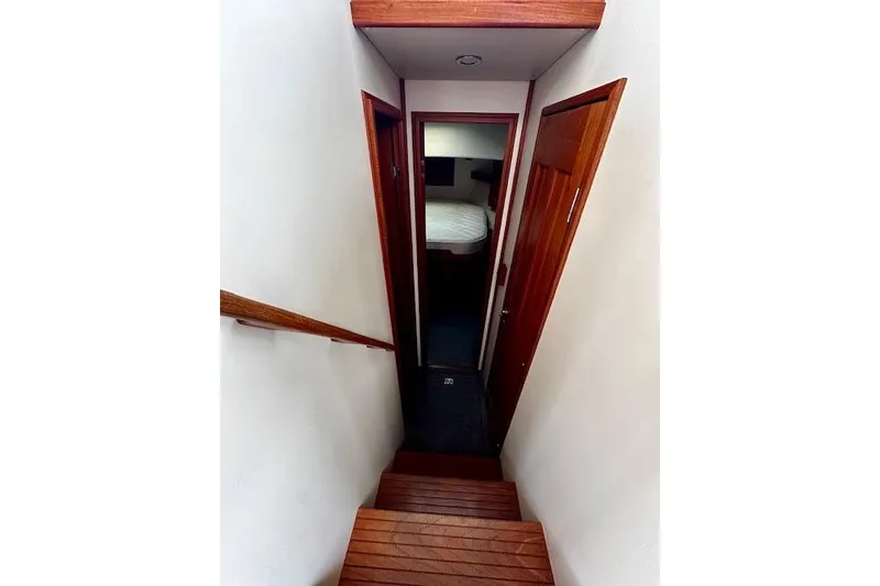 Slide: The Image of Stairway leading to cabin in 2006 Nordic Tug 37 boat interior. - 25