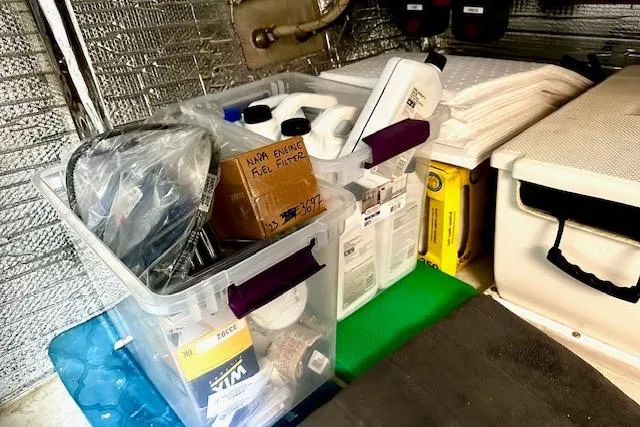 Slide: The Image of Storage area on a 2006 Nordic Tug 37 with organized maintenance supplies. - 37