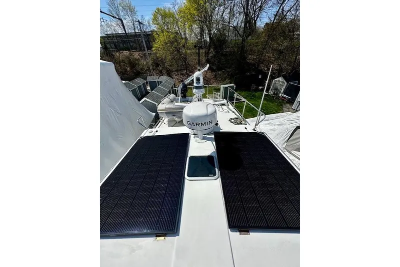 Slide: The Image of 2006 Nordic Tug 37 with solar panels and Garmin equipment on deck. - 4