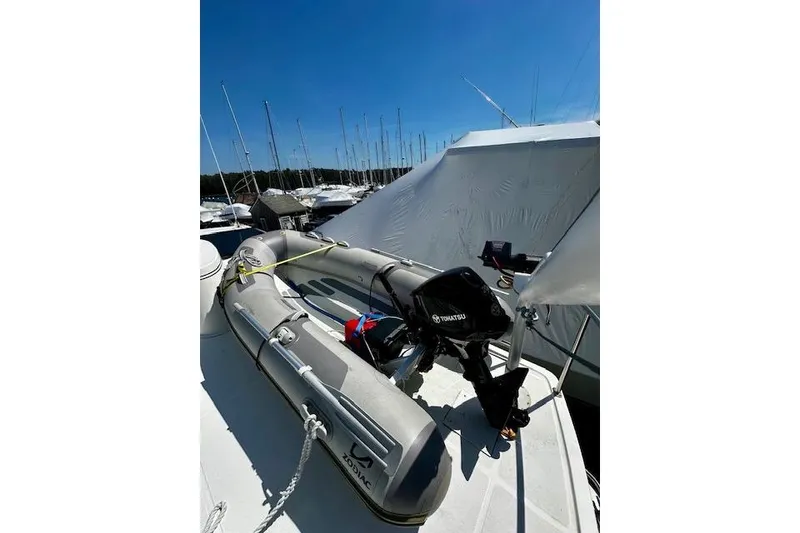 Slide: The Image of Inflatable Zodiac boat with Tohatsu motor on 2006 Nordic Tug 37 deck. - 7
