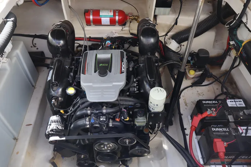 Slide: The Image of Engine compartment of a 2011 Sea Ray Sundancer 280 with visible batteries and fire extinguisher. - 16