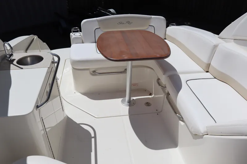 Slide: The Image of 2011 Sea Ray Sundancer 280 interior with seating, table, and sink. - 26