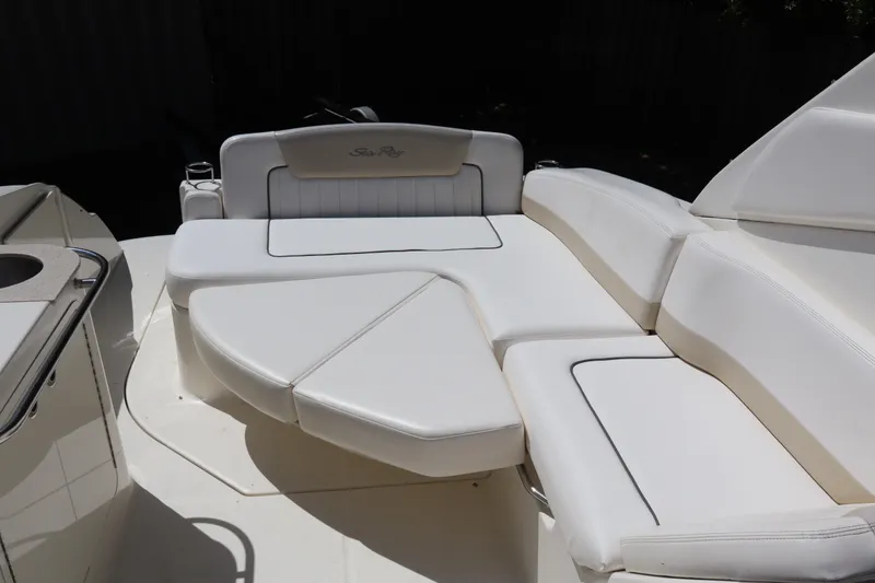 Slide: The Image of Luxurious seating on 2011 Sea Ray Sundancer 280 boat, featuring white cushioned upholstery. - 27