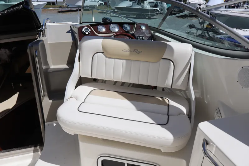 Slide: The Image of 2011 Sea Ray Sundancer 280 boat deck with railings and hatches, docked at marina. - 31