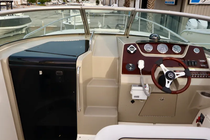 Slide: The Image of Compact bathroom in 2011 Sea Ray Sundancer 280 yacht with sink, toilet, and porthole window. - 42