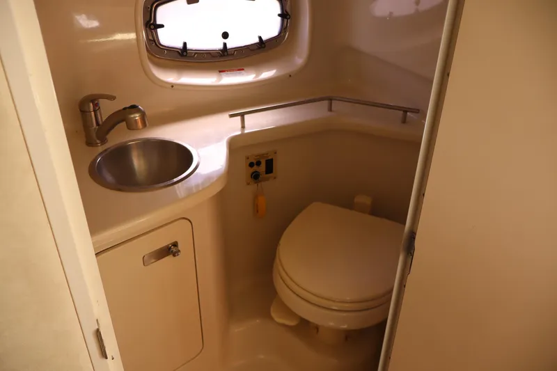 Slide: The Image of Compact bathroom in 2011 Sea Ray Sundancer 280 yacht with sink and toilet. - 43