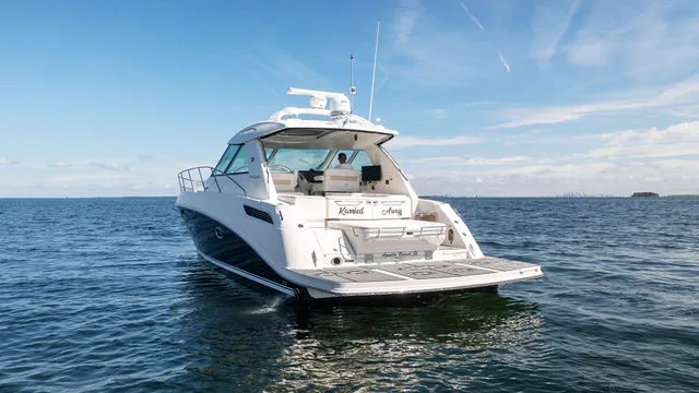 Slide: The Image of 2011 Sea Ray Sundancer 280 helm with gauges and steering wheel in cockpit view. - 5