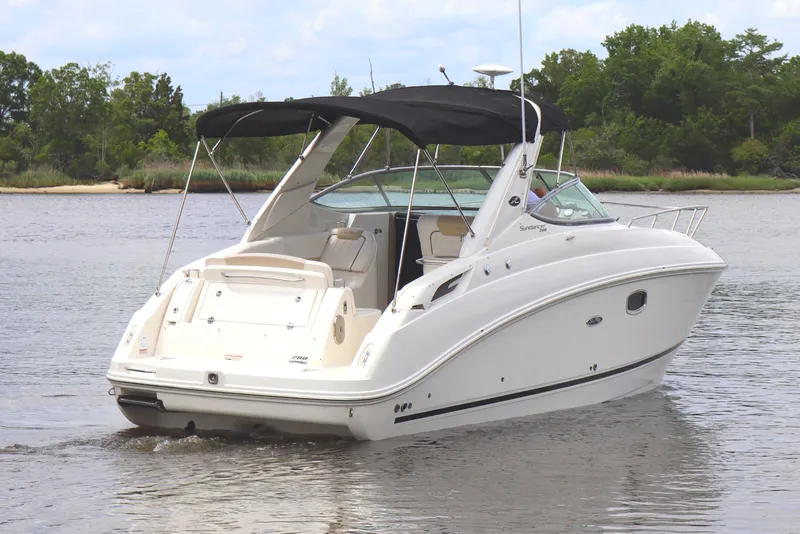 Slide: The Image of 2011 Sea Ray Sundancer 280 boat on trailer in outdoor setting. - 8