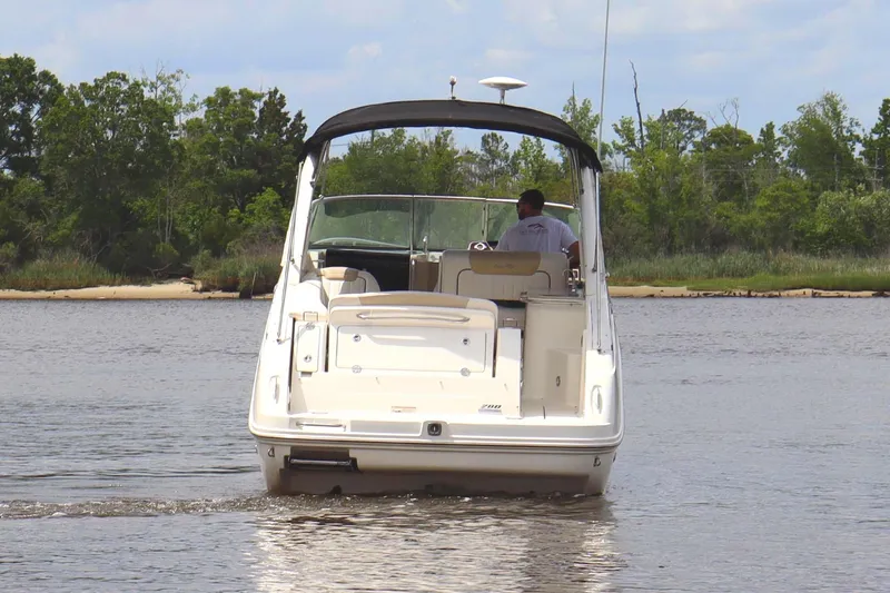 Slide: The Image of 2011 Sea Ray Sundancer 280 boat on trailer, displayed outdoors. - 9