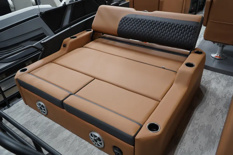 Slide: The Image of Luxurious seating in 2026 Sylvan L3 ULZ boat, featuring tan upholstery and integrated cup holders. - 10