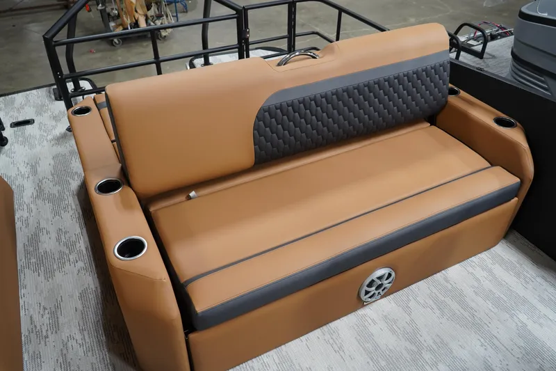Slide: The Image of Luxurious tan seating on 2026 Sylvan L3 ULZ boat with cup holders and speaker. - 4