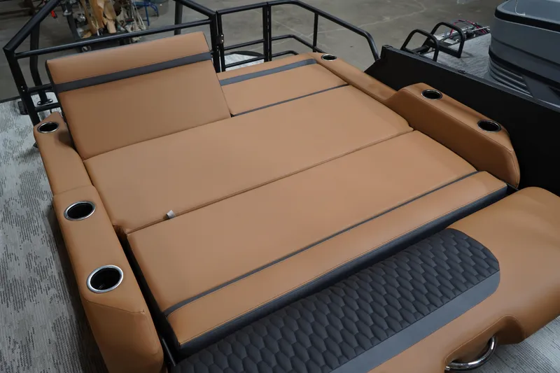Slide: The Image of Luxurious tan seating on 2026 Sylvan L3 ULZ boat, featuring integrated cup holders. - 8