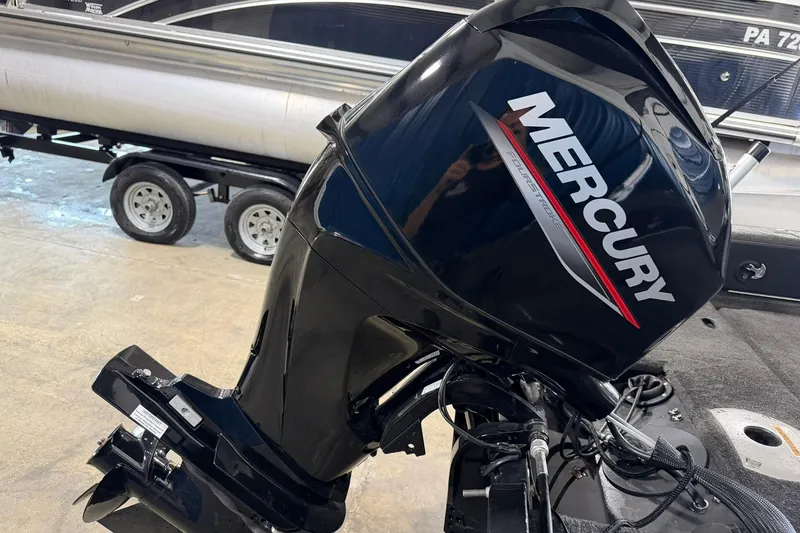 Slide: The Image of Mercury outboard motor on 2015 Starweld 1600 DC Ski boat in garage setting. - 11