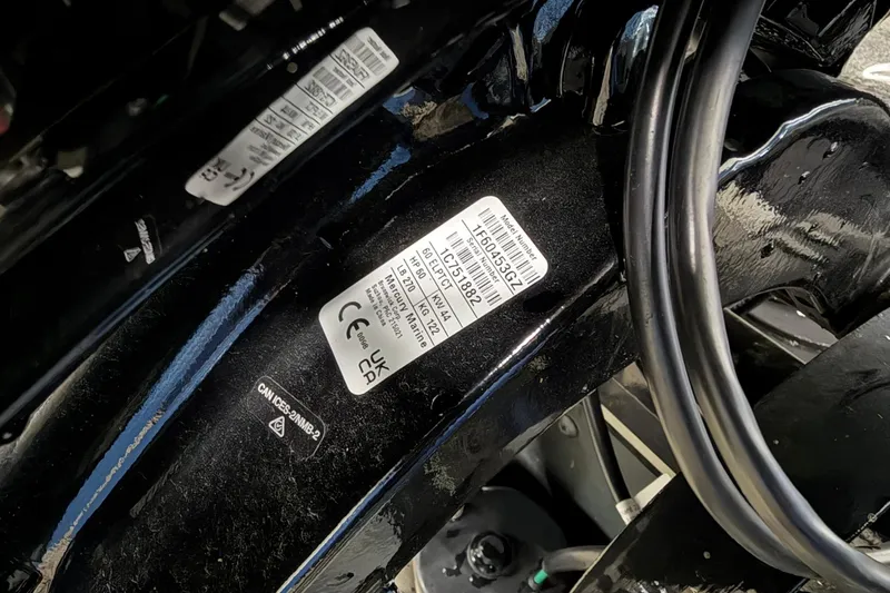 Slide: The Image of Label on a 2015 Starweld 1600 DC Ski boat engine, showing model and certification details. - 14