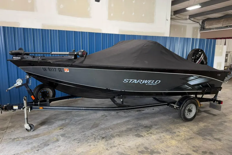 Slide: The Image of 2015 Starweld 1600 DC Ski boat on trailer, covered, in indoor storage. - 4