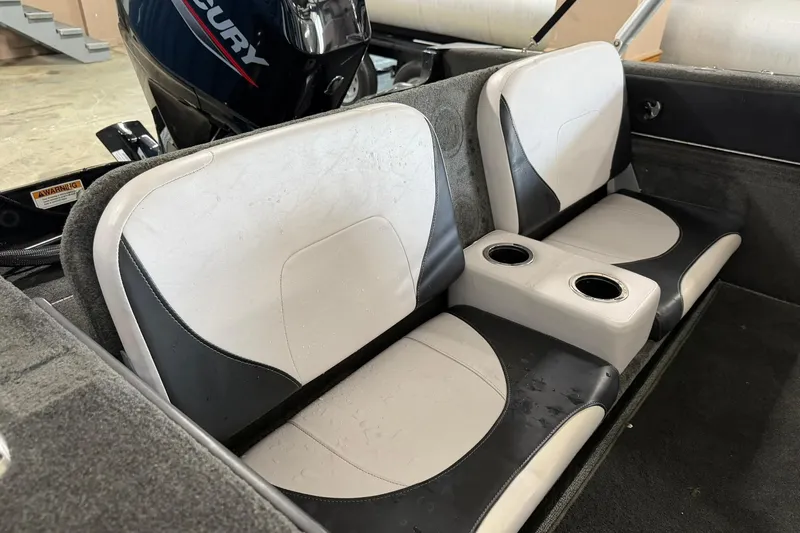 Slide: The Image of Interior seating of a 2015 Starweld 1600 DC Ski boat with dual cup holders. - 6