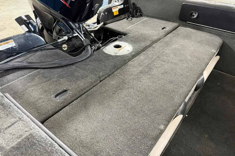 Slide: The Image of Interior view of a 2015 Starweld 1600 DC Ski boat, showcasing seating and motor area. - 8