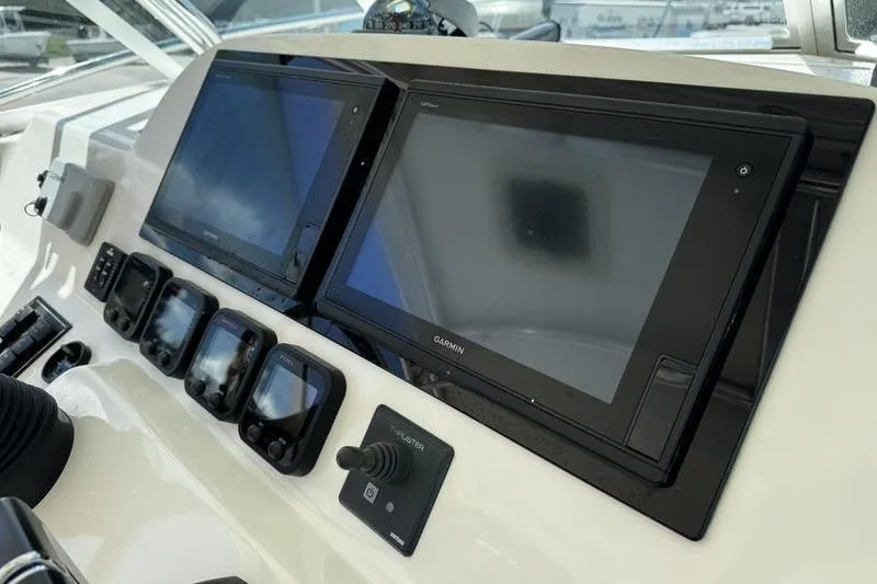 Slide: The Image of Dashboard of 2009 Pursuit 345 Drummond Runner LS with Garmin navigation displays. - 12