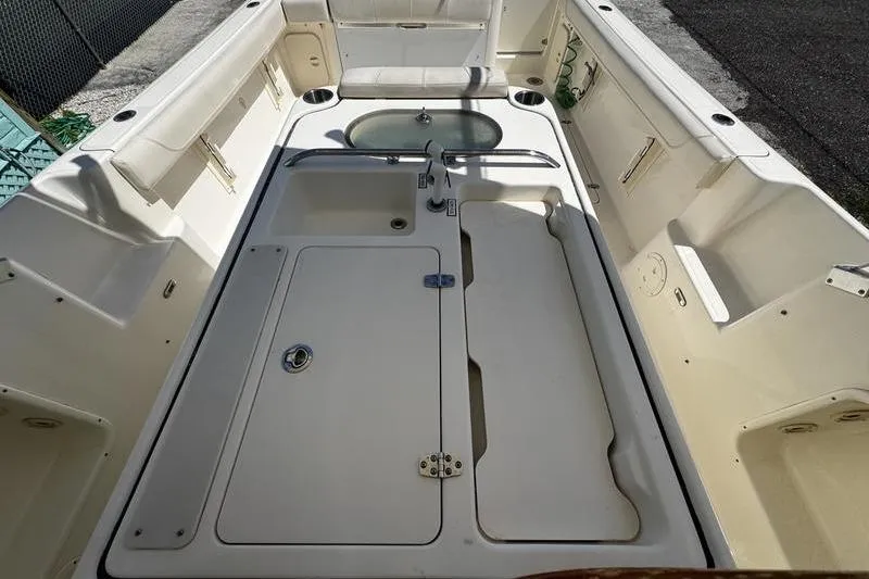 Slide: The Image of 2009 Pursuit 345 Drummond Runner LS boat interior with storage and seating. - 17