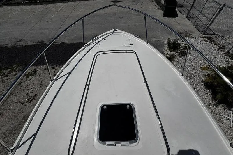 Slide: The Image of Bow view of 2009 Pursuit 345 Drummond Runner LS boat, docked on concrete. - 20