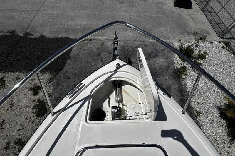 Slide: The Image of Bow view of 2009 Pursuit 345 Drummond Runner LS boat with open anchor hatch. - 21
