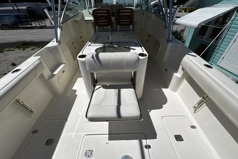 Slide: The Image of 2009 Pursuit 345 Drummond Runner LS boat interior with seating and helm station. - 26