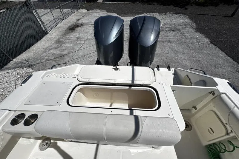 Slide: The Image of 2009 Pursuit 345 Drummond Runner LS boat with dual engines and spacious deck layout. - 30