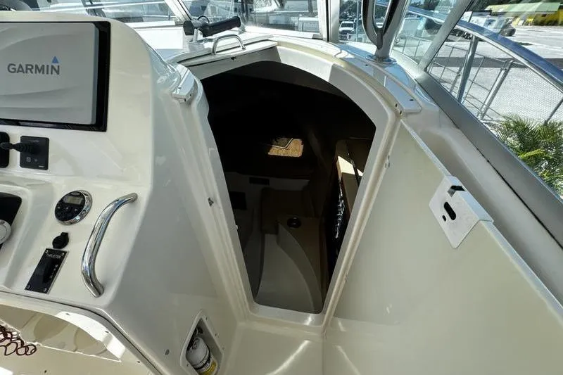Slide: The Image of 2009 Pursuit 345 Drummond Runner LS cabin entrance with Garmin navigation system. - 34