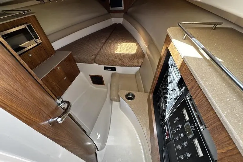 Slide: The Image of Interior of 2009 Pursuit 345 Drummond Runner LS boat with cozy cabin and modern amenities. - 35