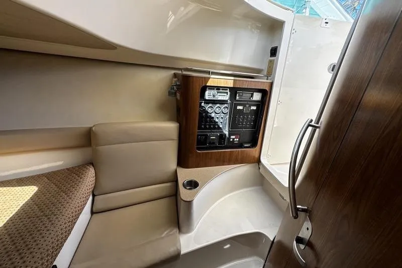 Slide: The Image of Interior of 2009 Pursuit 345 Drummond Runner LS boat with control panel and seating. - 37