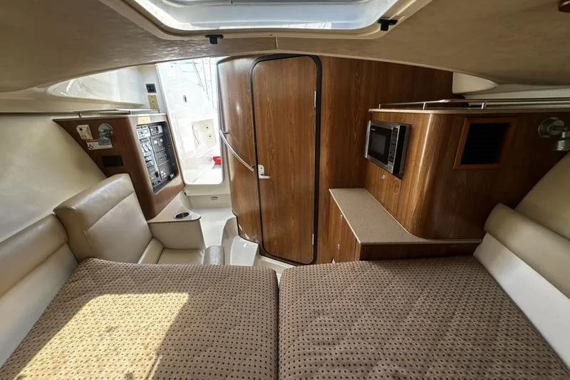 Slide: The Image of Interior of 2009 Pursuit 345 Drummond Runner LS boat with cozy cabin layout. - 40
