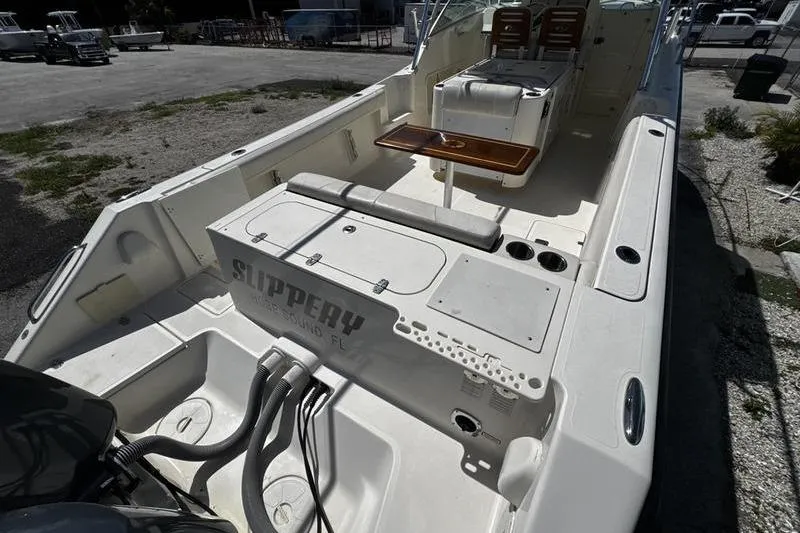 Slide: The Image of 2009 Pursuit 345 Drummond Runner LS boat interior with seating and fishing equipment. - 53
